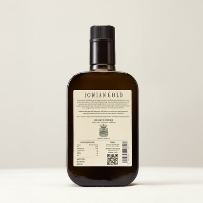 Rear of bottle of 'Ionian Gold' black cap olive oil 