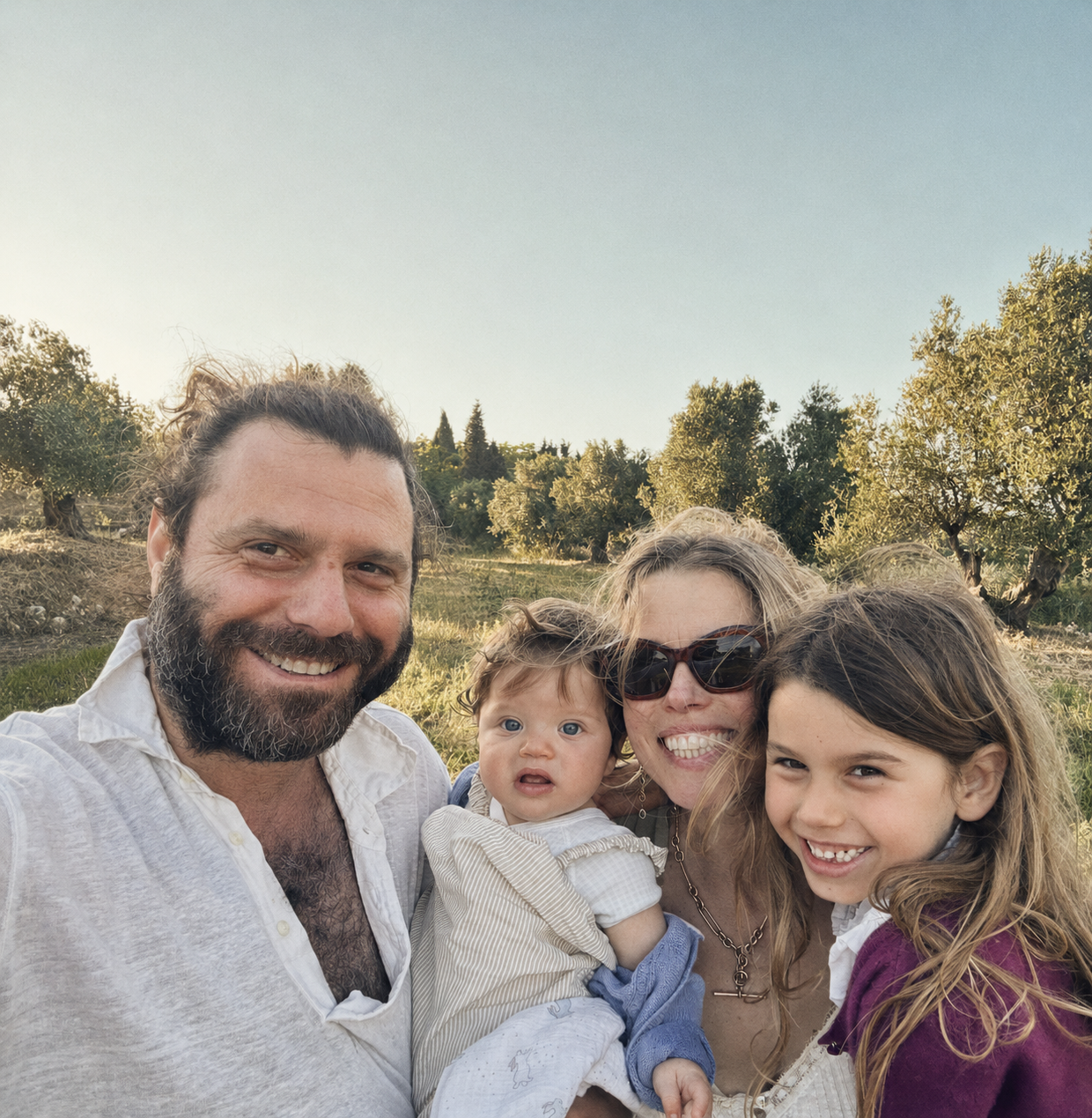 Nicholas Dellaportas with his family on their olive grove in Kefalonia, Greece