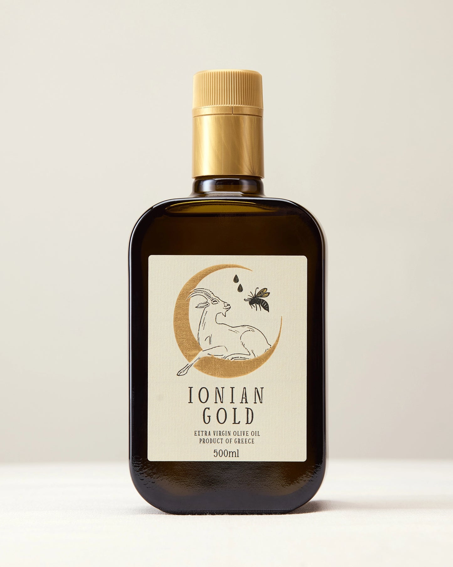 Ionian Gold 'Gold Cap' olive oil product shot from the front.