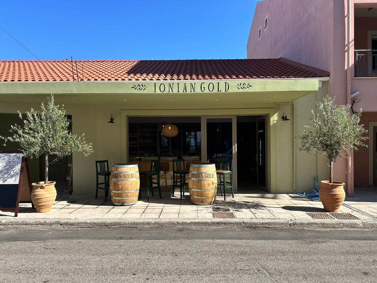 Ionian Gold storefront in Lixouri, Kefalonia, home of olive oil tastings and local produce.